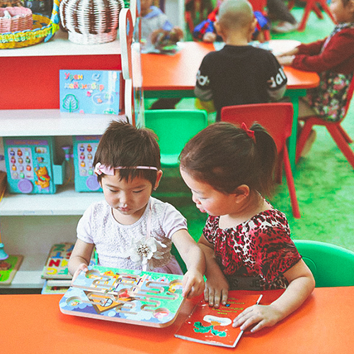 save plus project demo-two kids playing and reading together.